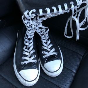 Tall black leather Converse